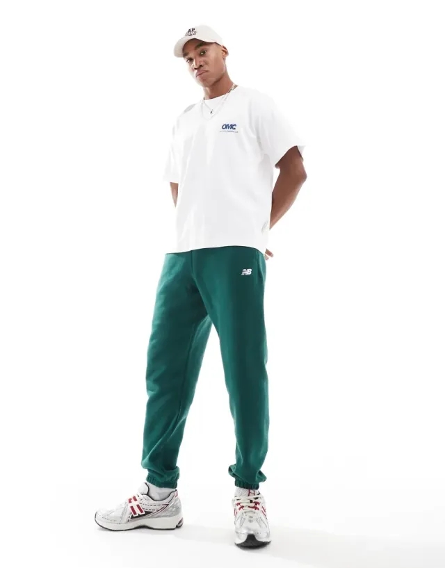 New Balance Men's Sport Essentials Fleece Jogger in Green Cotton